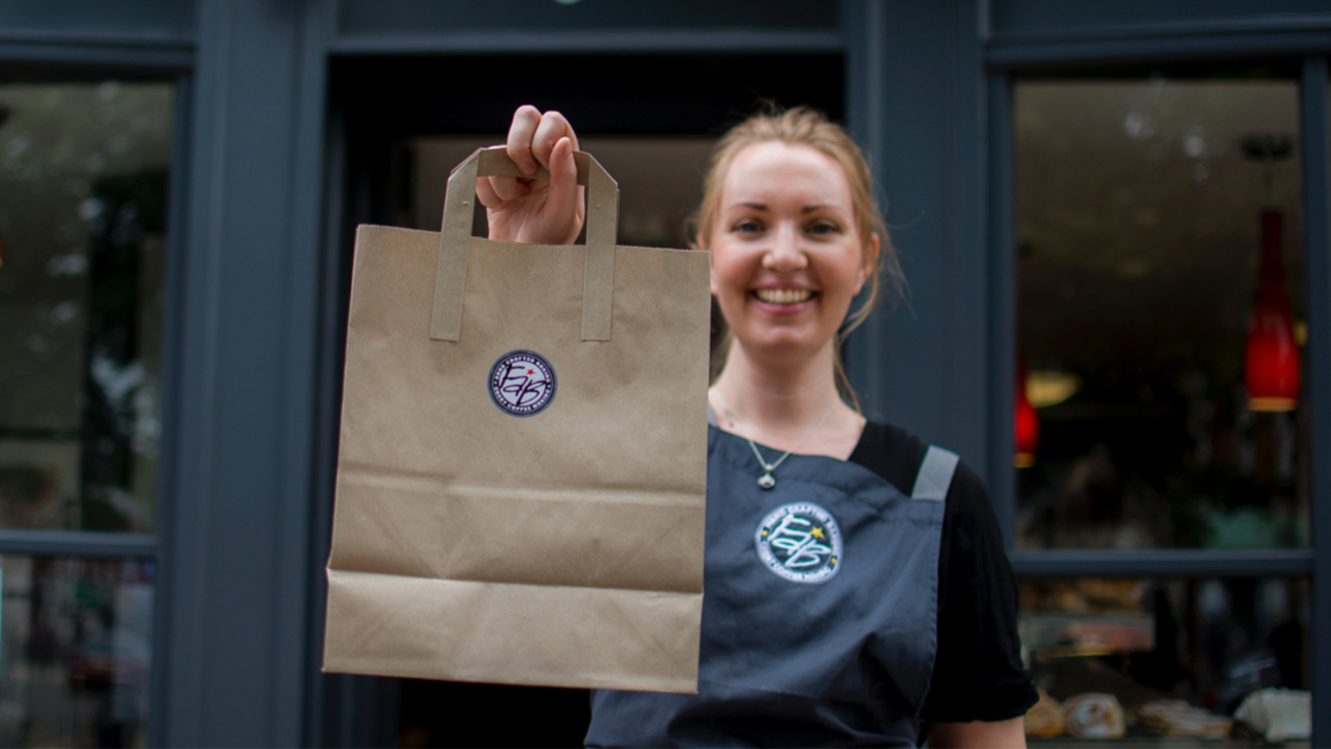 Flour and Bean lady with takeaway bag