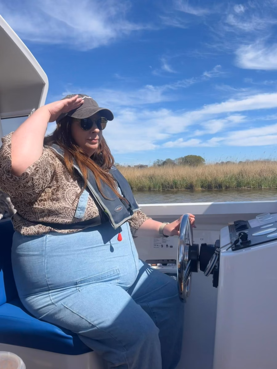 Megan driving boat