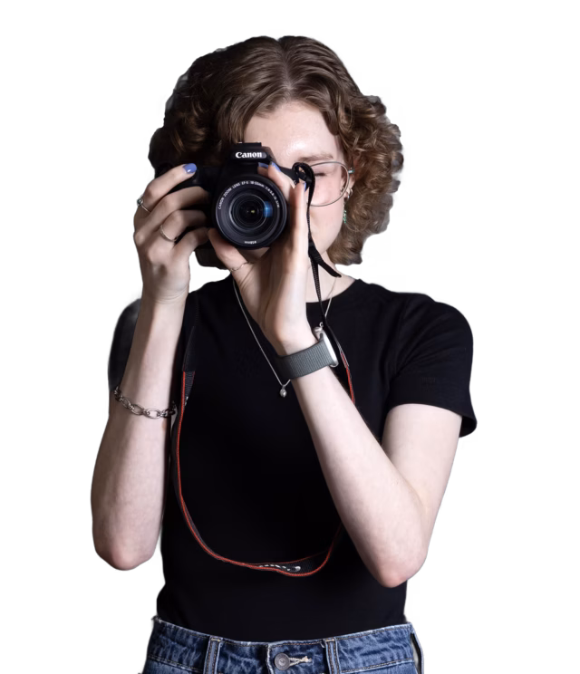 Photo of Chloe, holding a camera